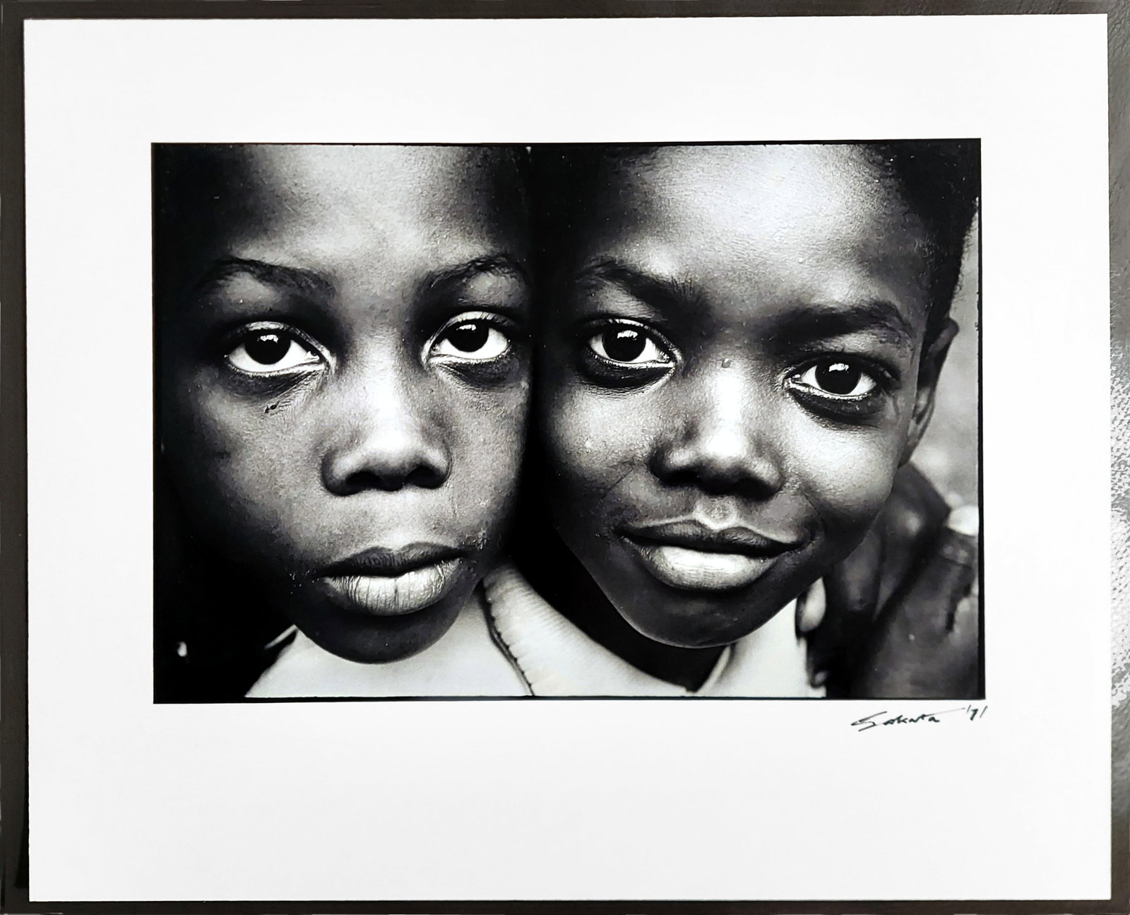 Eiichiro Sakata: Just Wait, Times Square 1977 Gelatin Silver Print: Eiichiro Sakata, (Japanese, b.1941 Tokyo): From Just Wait, Times Square 1966-70.Signed at the lower right. Gelatin Silver Print 8 ¼ x 12 ½ inches. Sheet 13 x 16 inches. Eiichiro Sakata is a