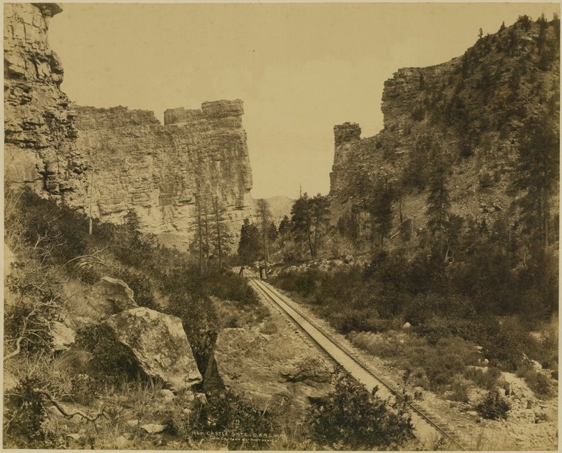 [PHOTOGRAPHY]. JACKSON, William Henry. “Castle Gate”: 486. [PHOTOGRAPHY]. JACKSON, William Henry. “Castle Gate,” view of a railroad scene in Utah showing rocky landscape with tracks and siding. Mammoth plate albumen print mounted on paperboar
