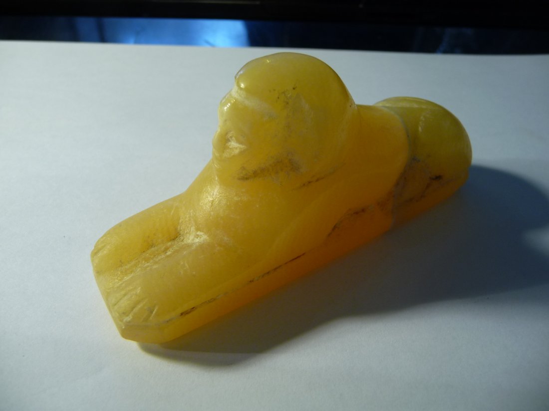 Interesting Carved Egyptian Sphinx Stone Figurine: 4" in length, roughly 1" wide. We believe this has a lot of age to it