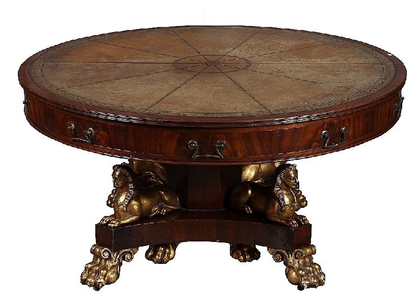 Empire Dining Room Table: Choice 19th Century round mahogany split pedestal dining room table with inset leather top raised on a claw footed pedestal with four carved gilt wood sphinx or crouching caryatid figures mounted to t
