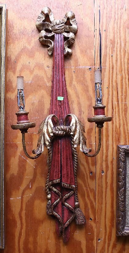 Pair of Italianate Sconces: Silver gilt and red painted tasseled bow tie form back plates with tole foliate decorated arms. Age: Mid 20th Century Condition: Good: Expected soiling and wear commensurate with age. Some small chips