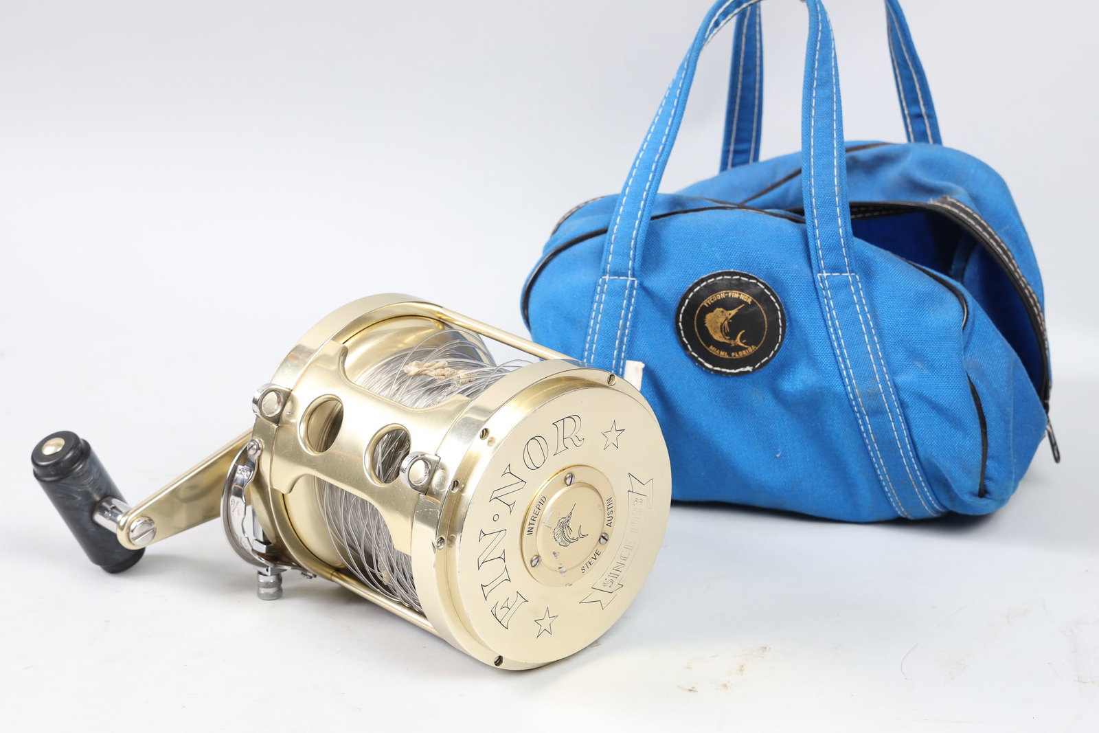 Tycoon Fin-Nor Deep Sea Reel: Tycoon Fin-Nor Big Game Deep Sea Variable-Speed Trolling Reel w/ Original Blue Bag. Size 12/0. Stamped "INTREPID / STEVE AUSTIN" on Right Side. S/N: 12A 740.