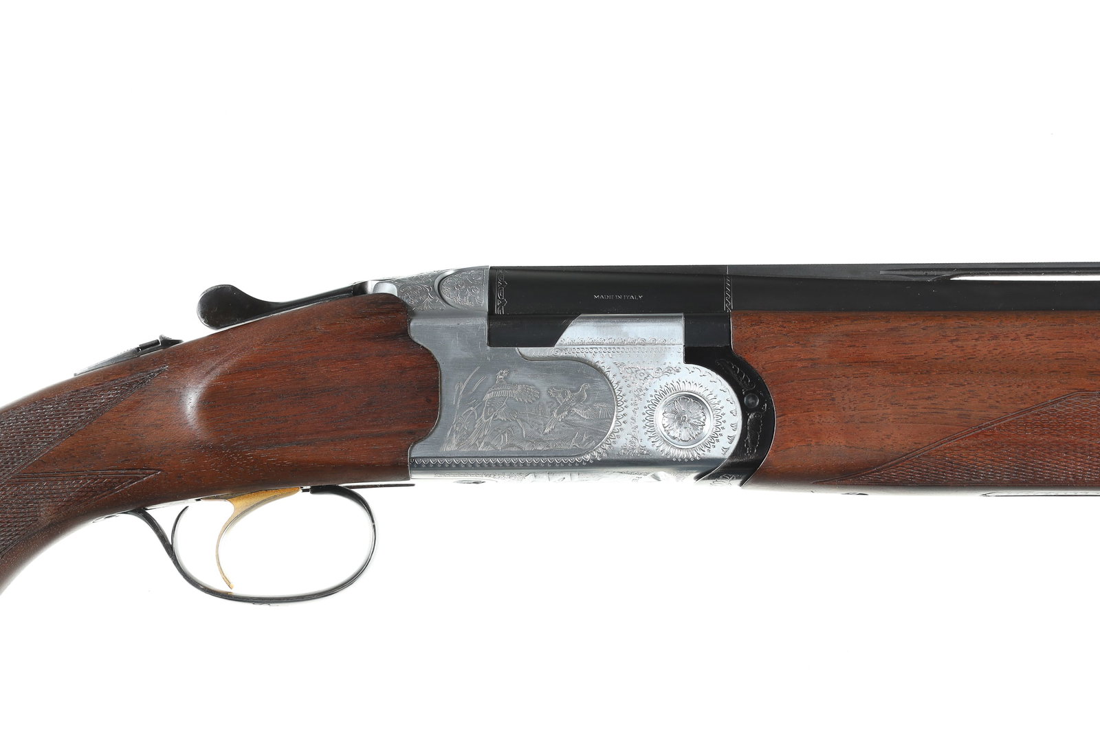 Beretta 687 Sporting O/U Shotgun 12ga: 12ga Serial # L18273B P. Beretta Model S 687 with 28" vent rib Bbl with interchangeable chokes. IC & Mod is installed. Single selective trigger with ejectors. Varnished walnut stocks. Coin finished Ga