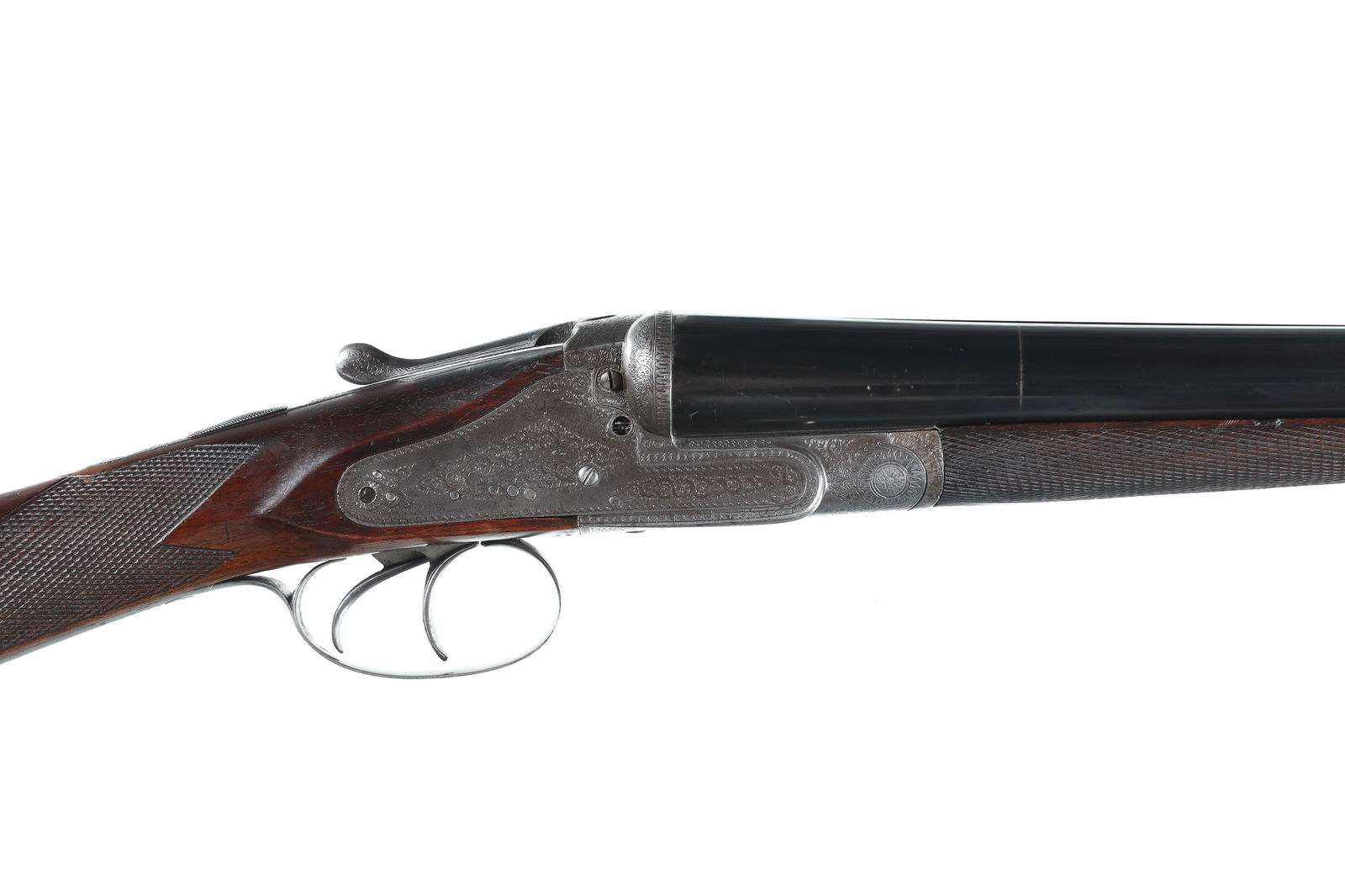 J. Beattie & Co. Sidelock non-ejector SxS Sho: 12ga Serial # 17867 J. Beattie & Co. English 12 bore with 28" Bbl 2 1/2" chamber Choke IM & Mod. with bright finished sidelocks with English scroll & foliate engraving. Double trigger with lifter extr