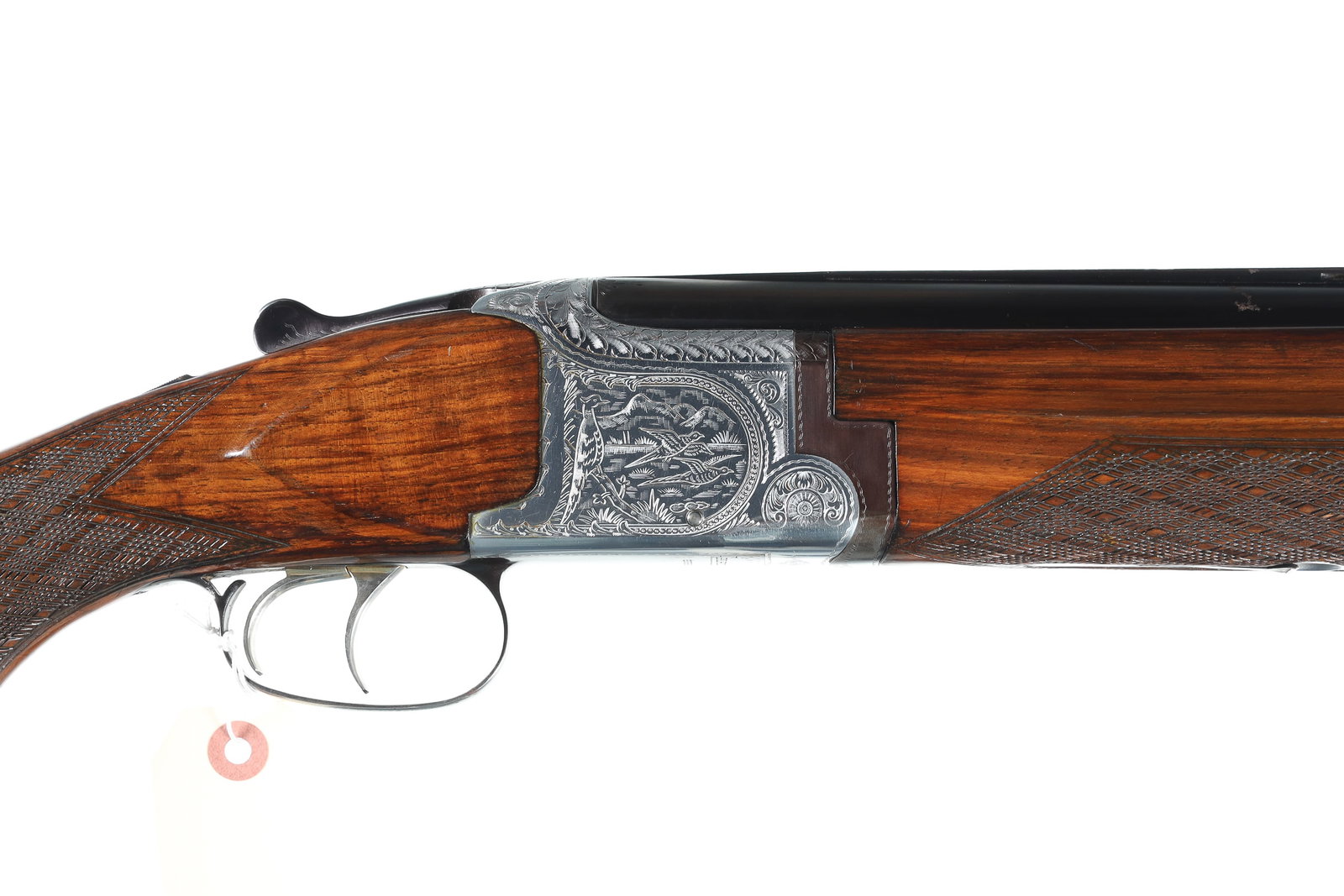 Laurona Sporter O/U Shotgun 12ga: 12ga Serial # 113165 Laurona Sporter 12 Ga. over under with game scene engraved coin finished receiver. 2 3/4" chamber,. 26" vent rib Bbl choked IC & IC. Double trigger with lifter extractors. 13 3/4"