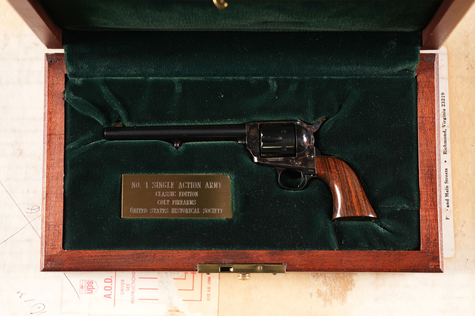 Miniature Colt SAA Replica: United States Historical Society Classic Edition Colt Single Action Army mini non-firing replica revolver with wooden display case, outer shipping box, and "The Art of Miniature Firearms" book by the