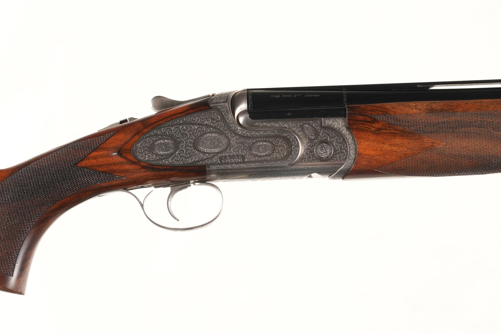 A2985 Caesar Guerini Essex Adjustable O/U Shotgun: 12ga Serial # 117456 Caesar Guerini Essex 12 ga over under with adjustable comb, 2 3/4" chamber 30" vent rib Bbl with extended interchangeable chokes 5 total. Single selective adjustable trigger. Scro