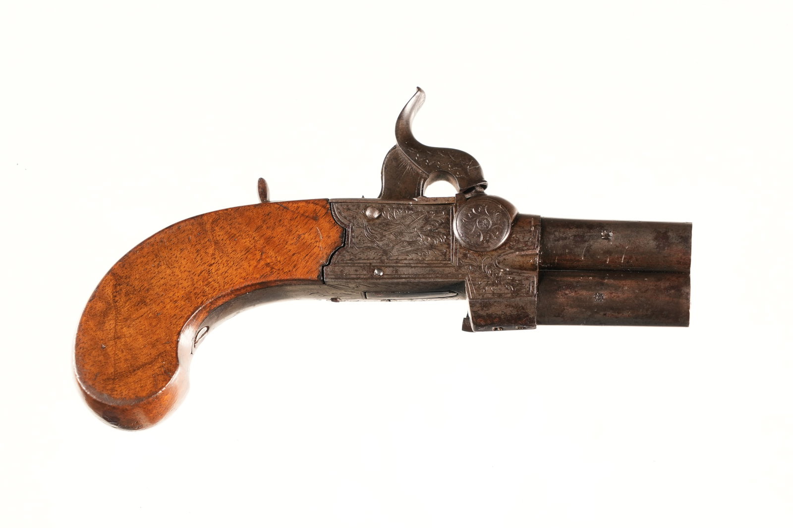 English Tap Action Pistol .36 perc: .36 perc Serial # NSN English Engraved Tap Action superimposed 2 Bbl pistol with varnished walnut stocks. Case color frame with browned Bbl's. Percussion with sliding hammer safety. Condition, Very go