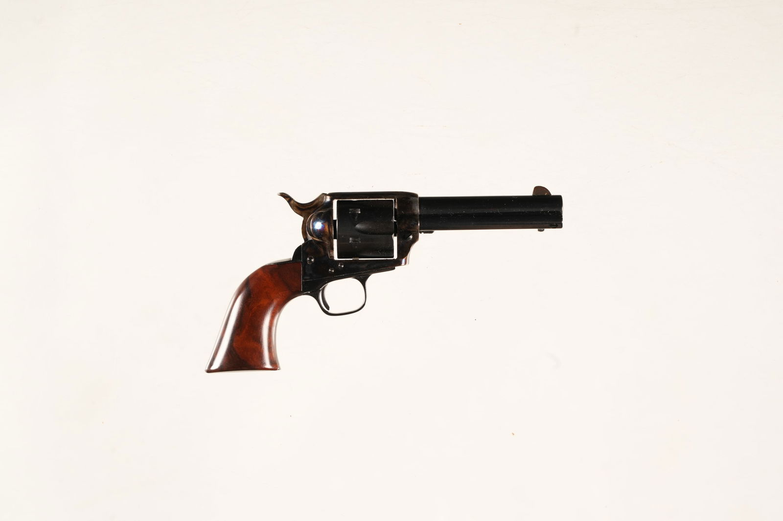 Uberti / Colt 1873 Miniature Revolver: Serial # 3149 Uberti 1/3 scale Model 1873 Colt Single Action revolver with case color frame and one piece varnished walnut grips. Meticulously made to emulate the famed colt single action and is fully