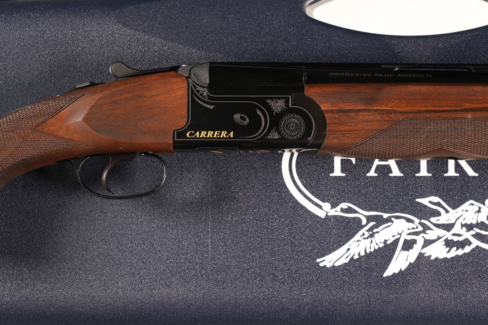 Fair Carrera One O/U Shotgun 12ga: 12ga Serial # 331225 Fair Carrera One12 Ga over under with single selective trigger and ejectors. Raised vent rib with interchangeable chokes ( 5 extended pattern w/ wrench). Varnished checkered pisto
