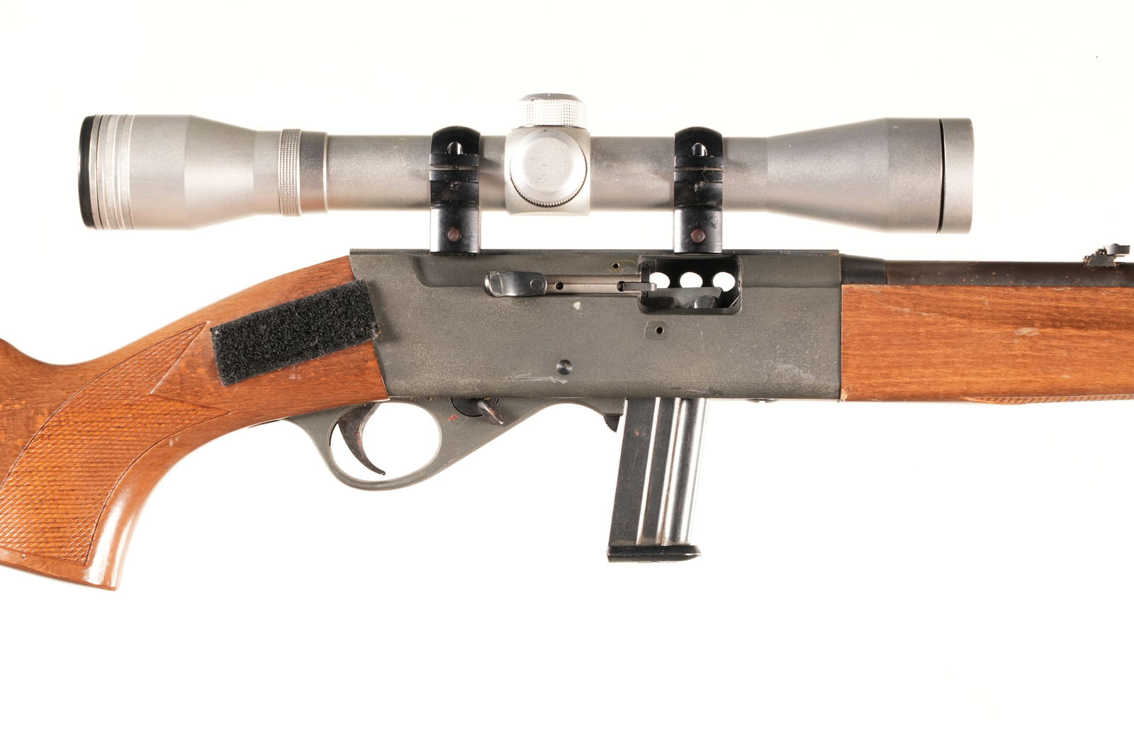 Anschutz 520 Semi Rifle .22 LR: .22 LR Serial # 136568 Anschutz Model 50 22 LR Semi Auto with detachable magazine, Grooved receiver and iron sights. Comes with Simmons Deerfield 4X scope. Condition, Metal remains very fine. Stocks a