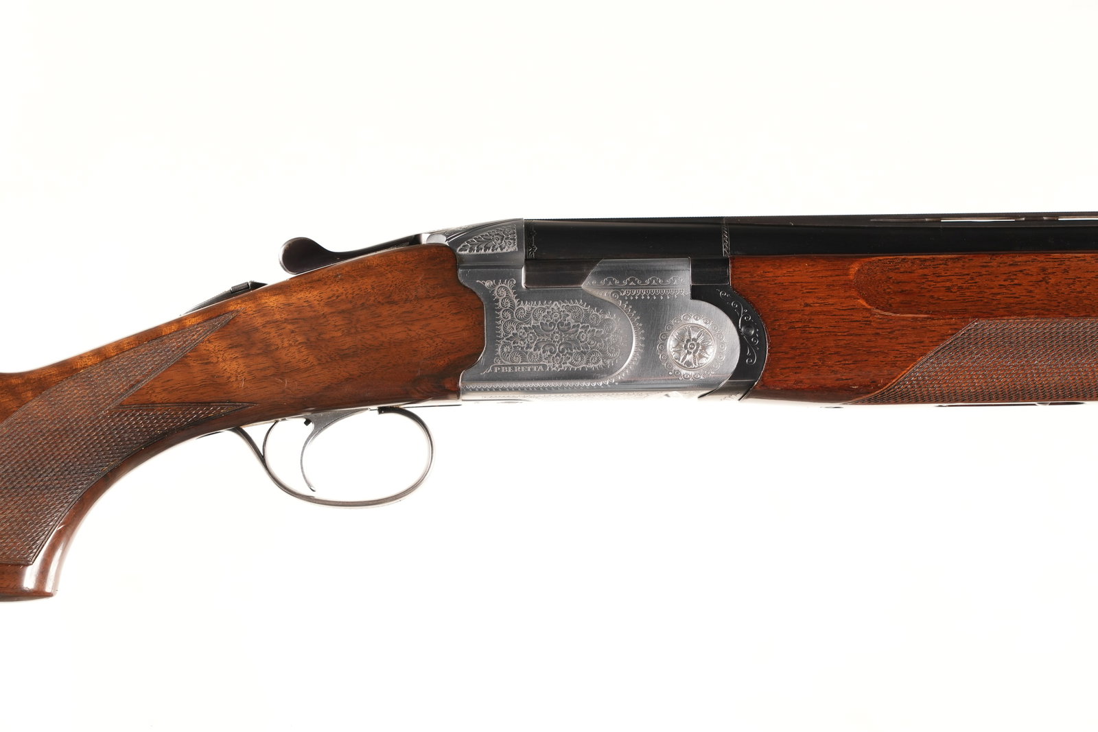 Beretta 686 O/U Shotgun 12 GA: 12 GA Serial # C23986B Factory engraved coin silvered receiver, varnished stock. 2 3/4" chambers. Fixed choked Mod/Imp Mod. LOP 14 3/8", single select trigger. Very good plus overall condition. Barrel