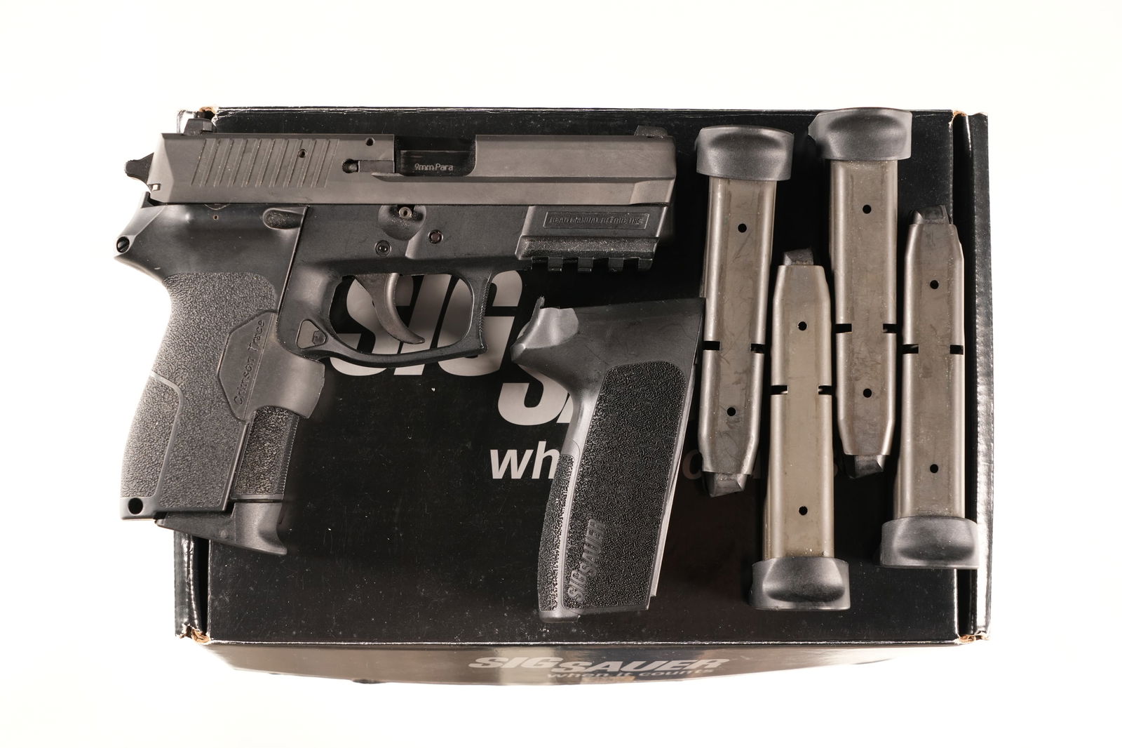 Sig Sauer SP2022 Pistol 9mm: 9mm Serial # 248140995 Excellent overall condition with light handling marks, crimson trace laser grips, factory box numbered to gun, with 4 additional magazines. Barrel 3 3/4" Modern. Sig Sauer, foun