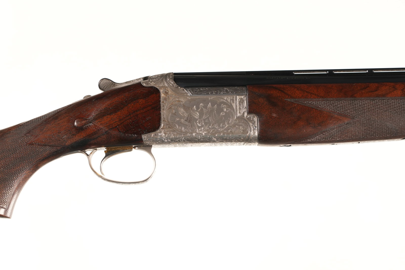 Browning B425 O/U Shotgun 12 GA: Browning B425 is a grade 5 over-under shotgun noted for its coin silver receiver and fine engraving. Manufactured in 1995, this 12ga serial #33927NP features figured walnut stock, carved teardrops, co