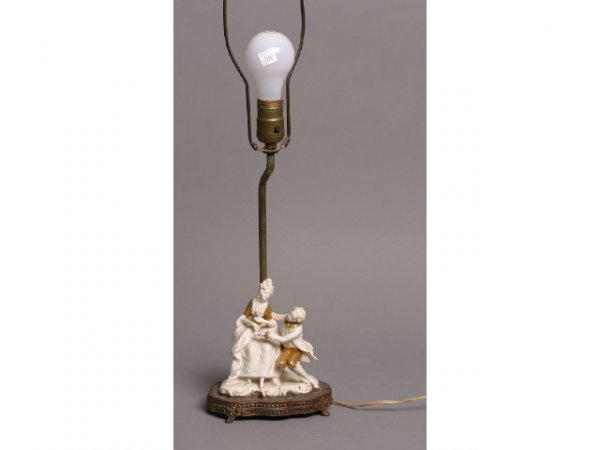 Porcelain figural lamp: Porcelain figural lamp, gentleman and lady; 25H; metal finish is worn Terms & Conditions: Live auction by Montrose Auction, Inc. Established 1977. We accept PayPal, Money Orders. Invoices are due 7 da