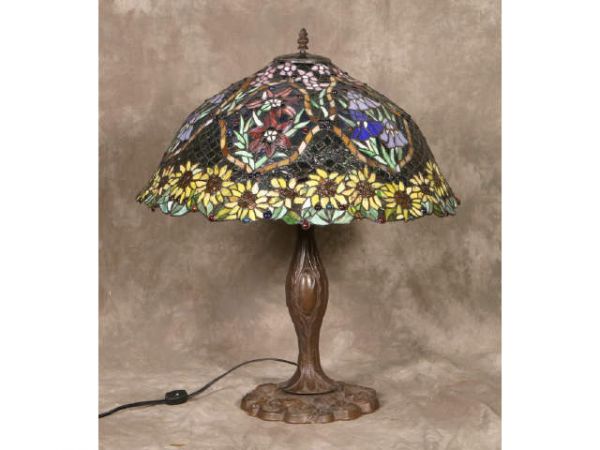 Table lamp w/Tiffany-style stained glass shade: Sunflower table lamp w/Tiffany-style stained glass shade Terms & Conditions: Live auction by Montrose Auction, Inc. Established 1977. We accept PayPal, Money Orders. Invoices are due 7 days after the