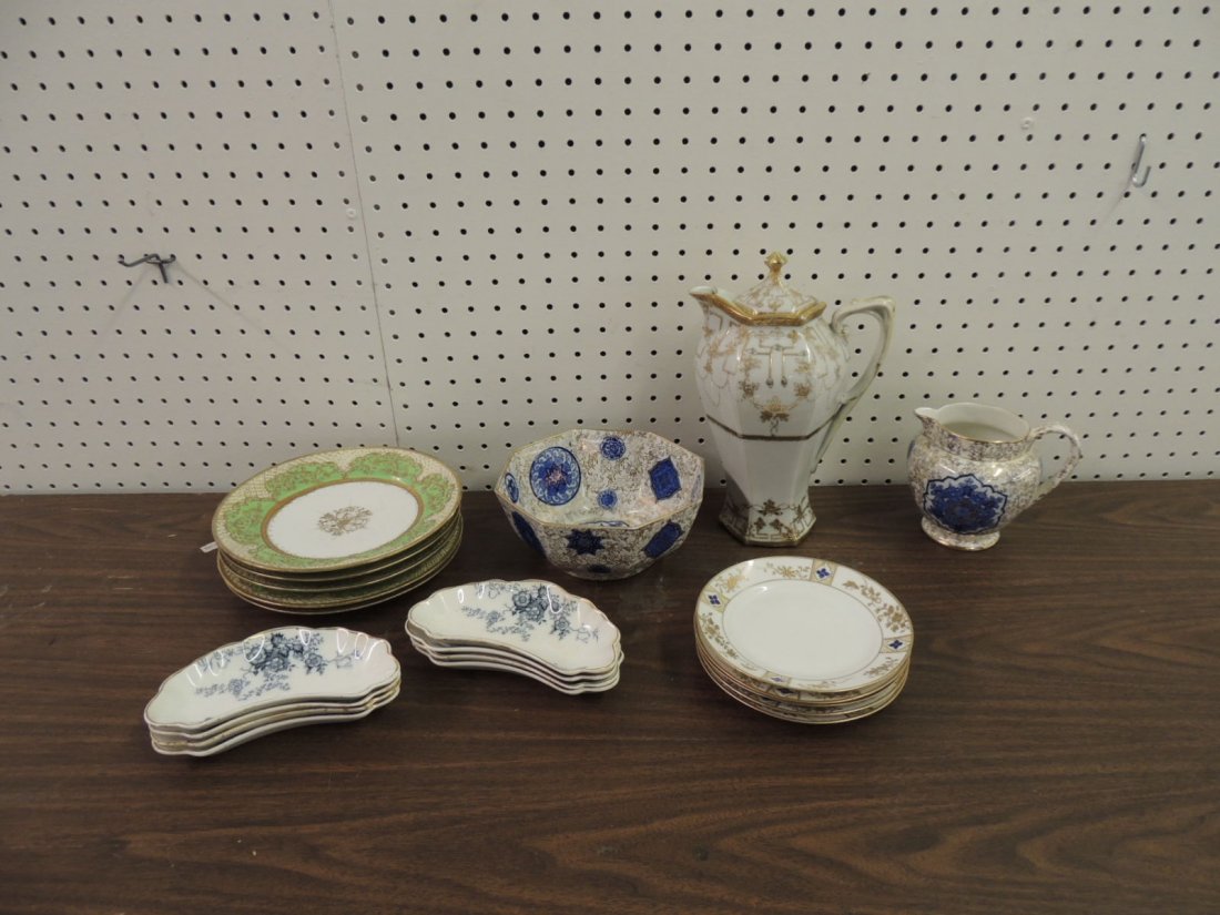 Group of 21 Porcelain Items Featuring Nippon and Others: Bone Plates, Coffee, Creamer, Bowls, and Plates, Largest 11"x6 1/2"