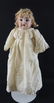 Antique Bisque Doll with Tan Dress