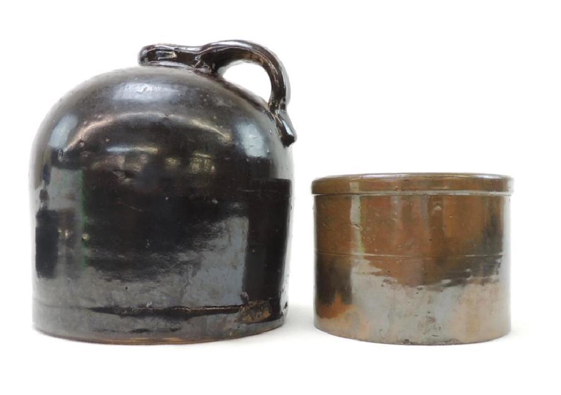 1 Gallon Brown Crock Jug and 2 Lb Brown Butter Crock: Beautiful glazing. No chips or cracks on jug. Butter crock has 2 small chips.