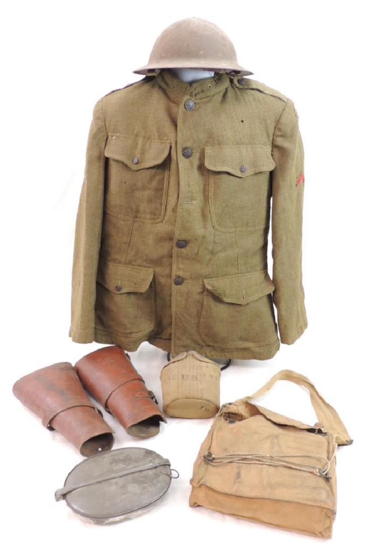 WW1 U.S. Army 88th Division Waggoneers Uniform Grouping: Featuring Helmet, Gas Mask, Canteen, Mess Kit, Leather Leggings, Discharge Stripe, Overseas Chevron, and Tunic