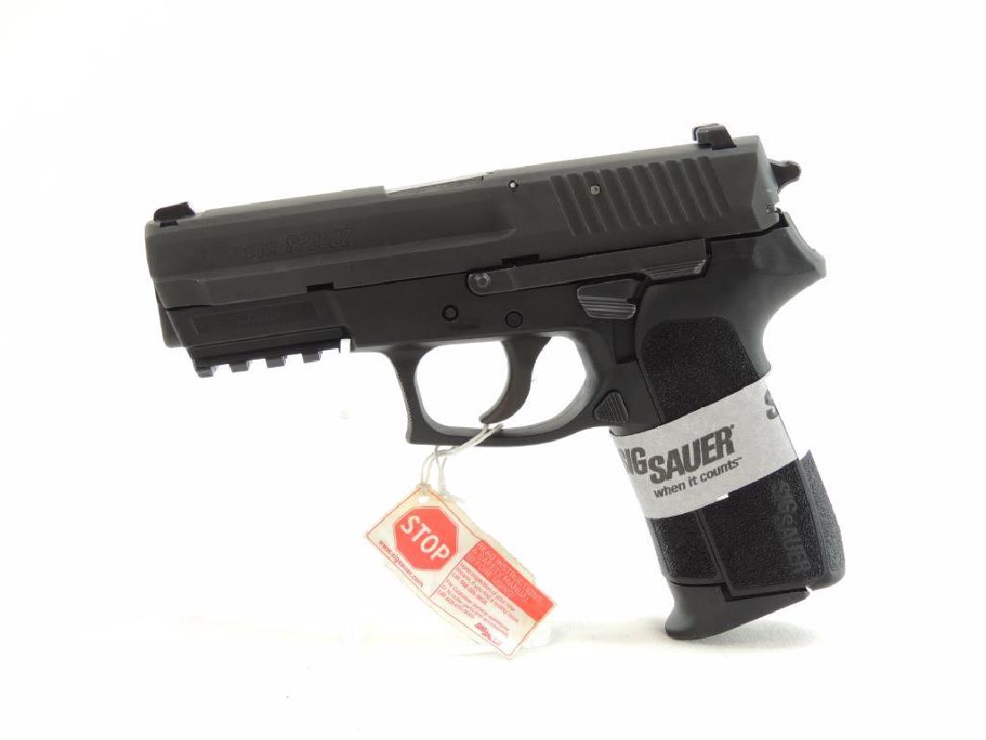 Sig Sauer Model SP2022 9mm Para Sig Semi-Auto Pistol: Serial Number 24B149667. New and Unfired Condition, Featuring Original Case, Magazine, Extra Grips, Holster, Lock, and Paperwork