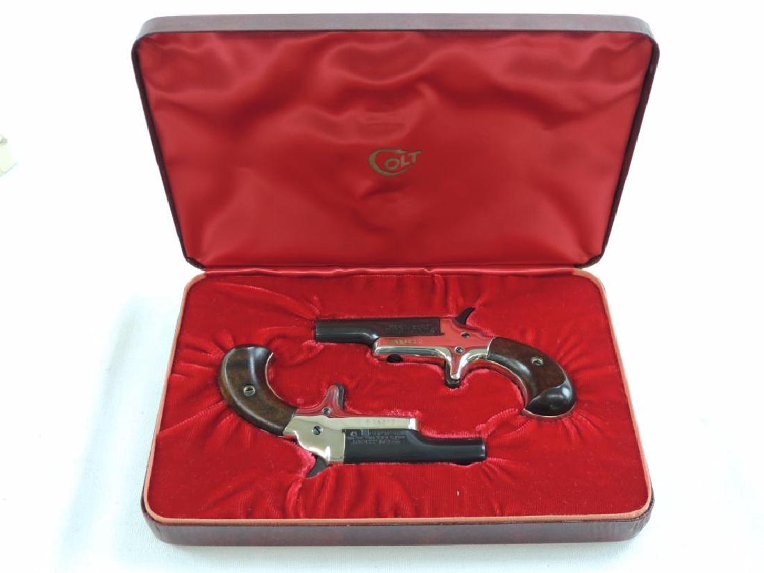 Colt Derringers .22 Cal. Short Pistols with Original: Serial Number 33202D and 33201D, Unfired Condition and Featuring's a Set of Colts Derringers with Case and Original Box