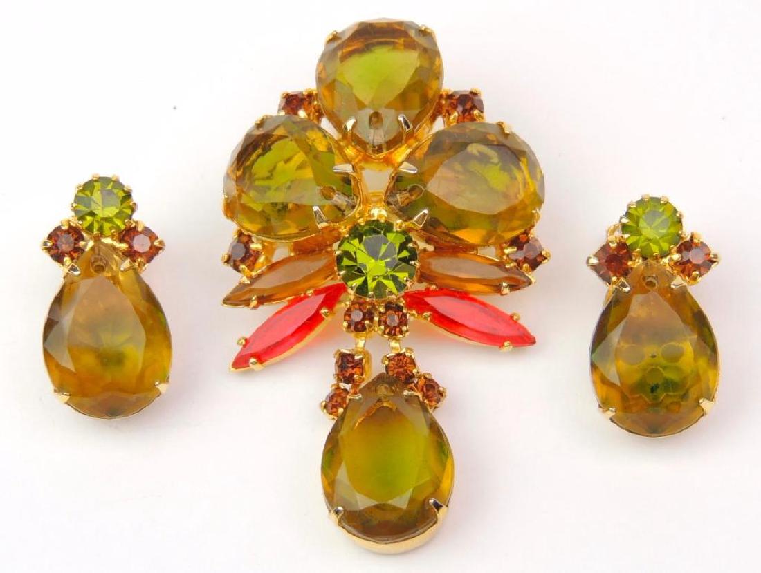 Vintage Green and Brown Rhinestone Brooch and Earring: Brooch measures approx. 2-1/4" x 1-1/4". Matching clip-on earrings are 1" and unsigned.