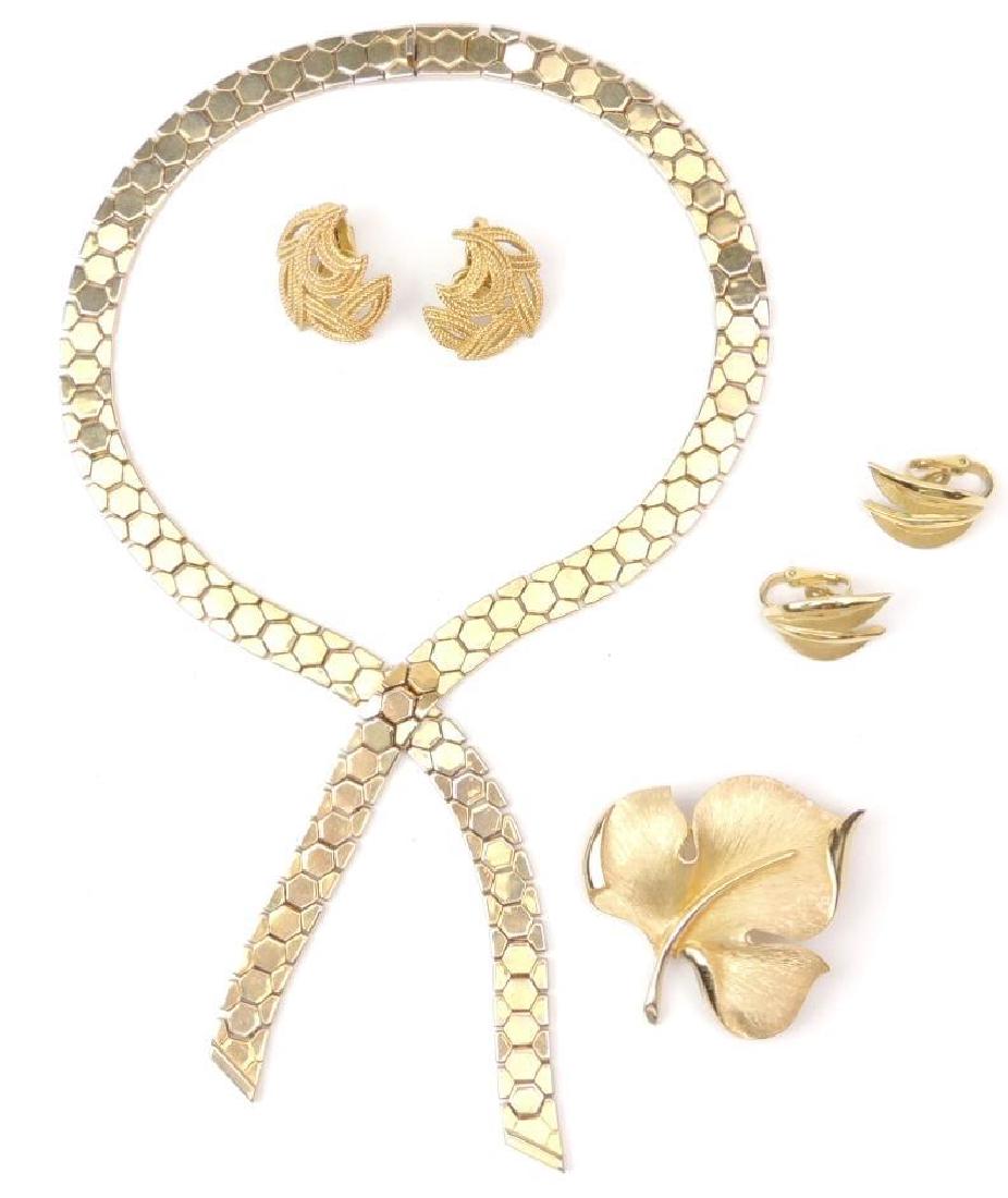 Trifari Lot : 2 Pairs of Earrings, Necklace and Brooch: 2 pairs of signed Trifari earrings are both clip-on, a 15" necklace and a 2" x 2" leaf brooch complete the signed collection
