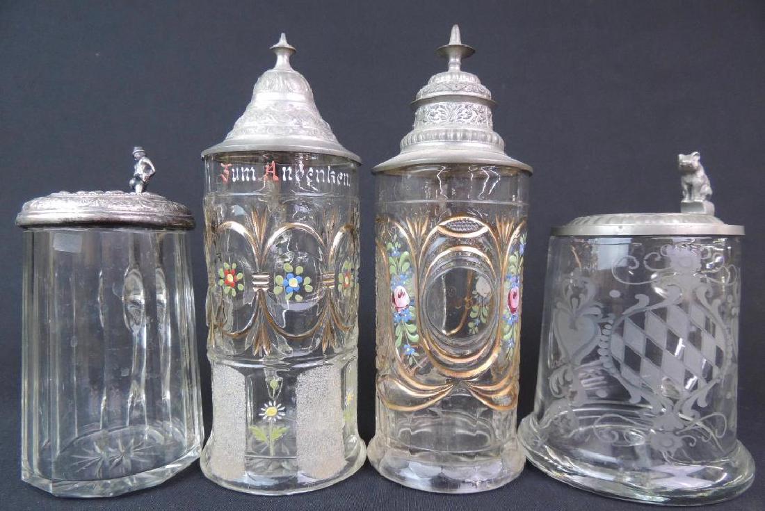 Lot of 4 Antique Glass Steins: Lot of Four Glass Steins, 1/2L , approx. 7 1/4 - 9 1/2" Tall. note: "bowler" thumb lever has repair some damage.
