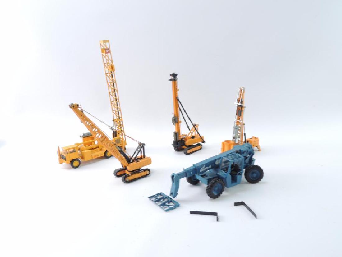 Group of 5 Die-Cast and Plastic Construction Vehicles: Various Scales, Largest 1/50, Featuring Well Drills, Crane, and Fork Lift, Manufactories Include NZG Modelle, Shinsei Mini, and More