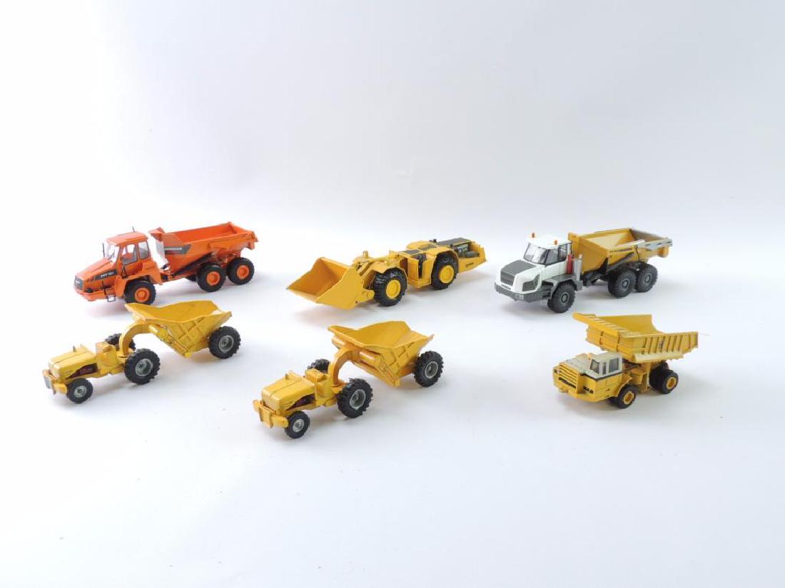 Group of 6 Die-Cast Toy Dump Trucks: Various Scales, Largest 1/50, Featuring Doosan, Libherr, GHH, and More, Manufactures Include Conrad, NZG Modelle, and More