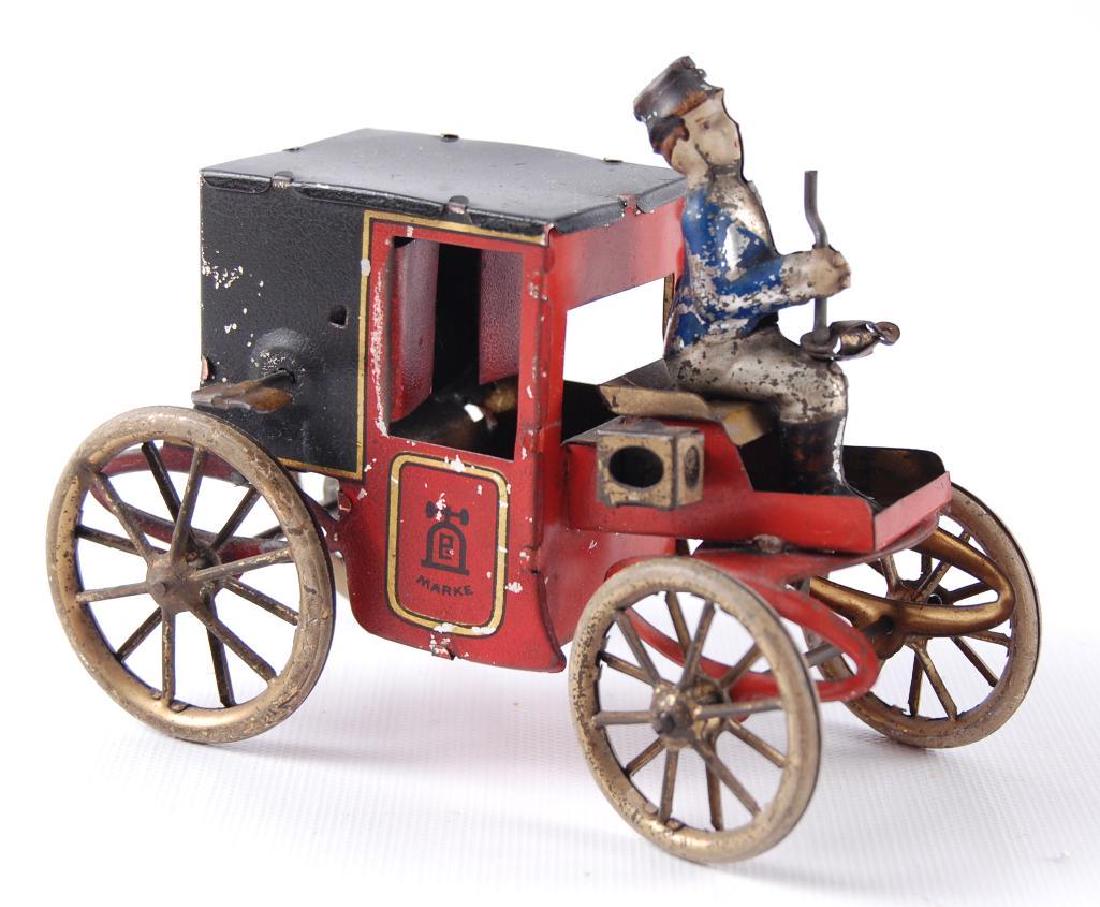 Antique DRGM Marke Wind-Up Toy Carriage with Driver: 5 x 2-1/2 x 3 inches. Non-working condition.