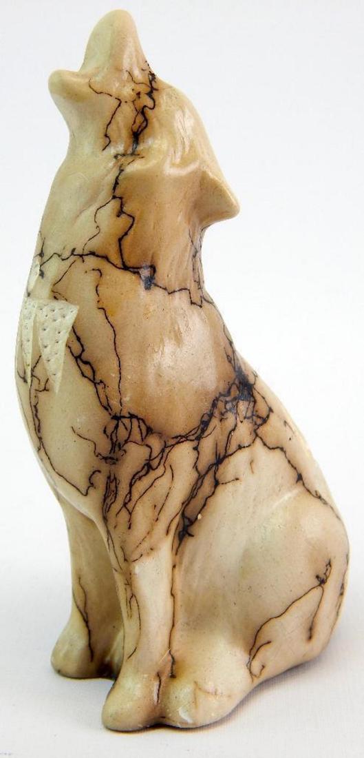 Signed Carved Coyote - T. Vail: 5 x 3 x 2-1/4. Horsehair is used to create the unusual glaze effect.