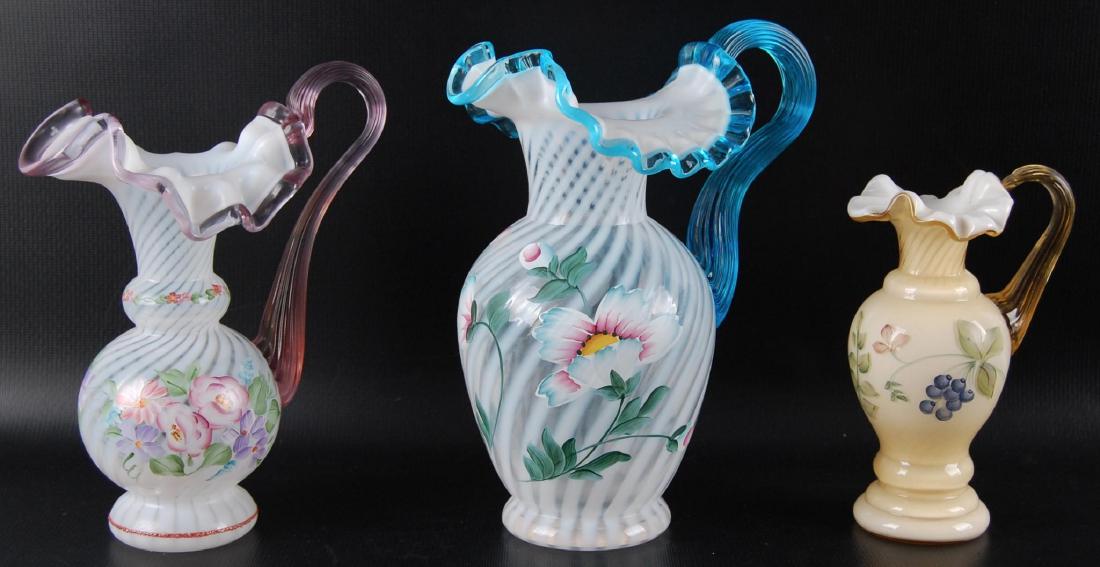 Group of 3 : Fenton Signed Ruffled Edge Pitchers: Opalescent Swirls, Applied Handles, Hand Painted Designs. Largest 7 1/2 x 9 x 6 inches