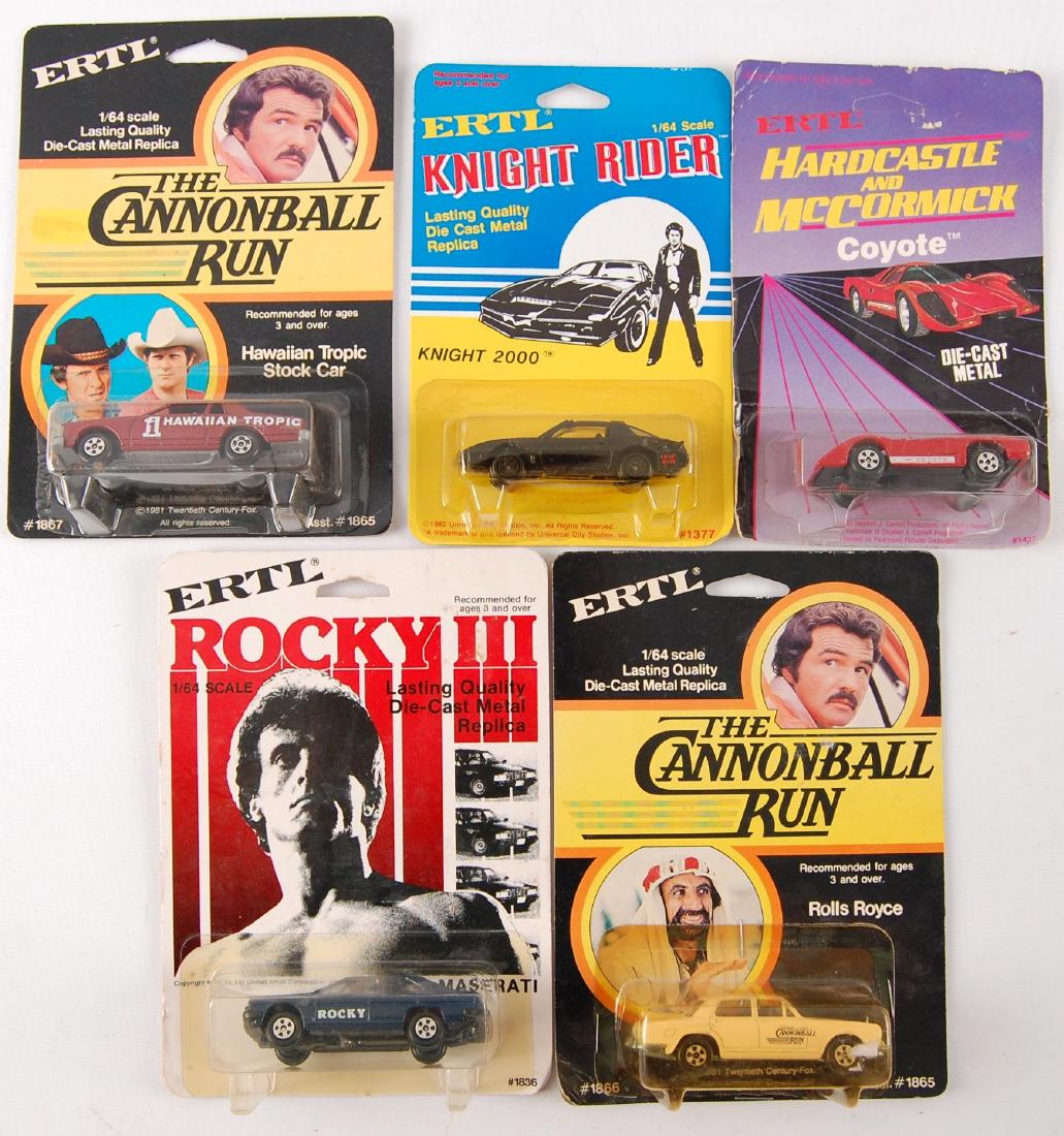 Group of 5 ERTL Toy Vehicles in Original Packaging: Includes No. 1866 The Cannonball Run Rolls Royce, No. 1867 Hawaiian Tropic Stock Car, No. 1377 Knight Rider Knight 2000, No. 1437 Hardcastle and McCormick Coyote, and No. 1836 Rocky 3 Maserati.