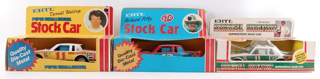 Group of 3 ERTL NASCAR 1/24 Scale Stock Cars in: Includes Darrell Waltrip Mountain Dew, Richard Petty STP, and Darrell Waltrip Pepsi Challenger.