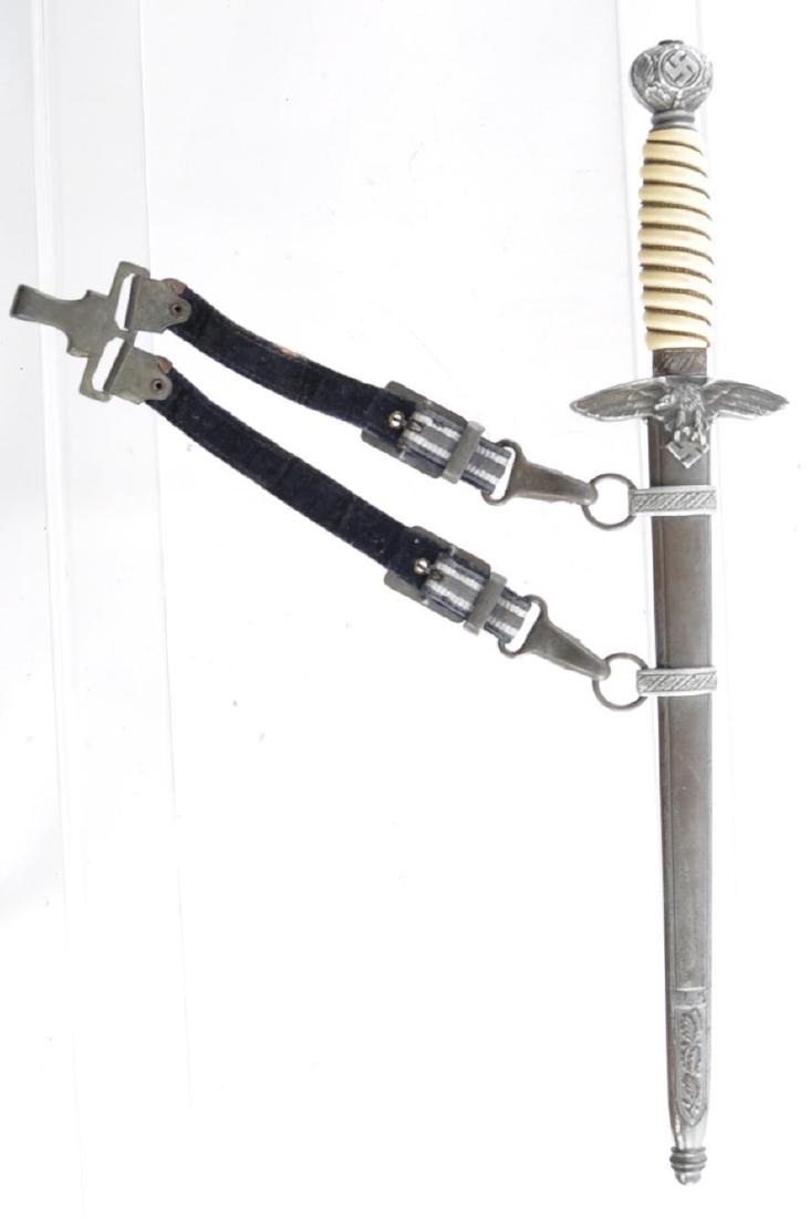 WW2 German Second Model Luftwaffe Dress Dagger with: Manufactured by Alcoso, Solingen. Blade has minor rust, no nicks. Haft is in good condition, Scabbard is in Excellent Condition, Overall length 17 inches, Blade is 9 3/4 inches