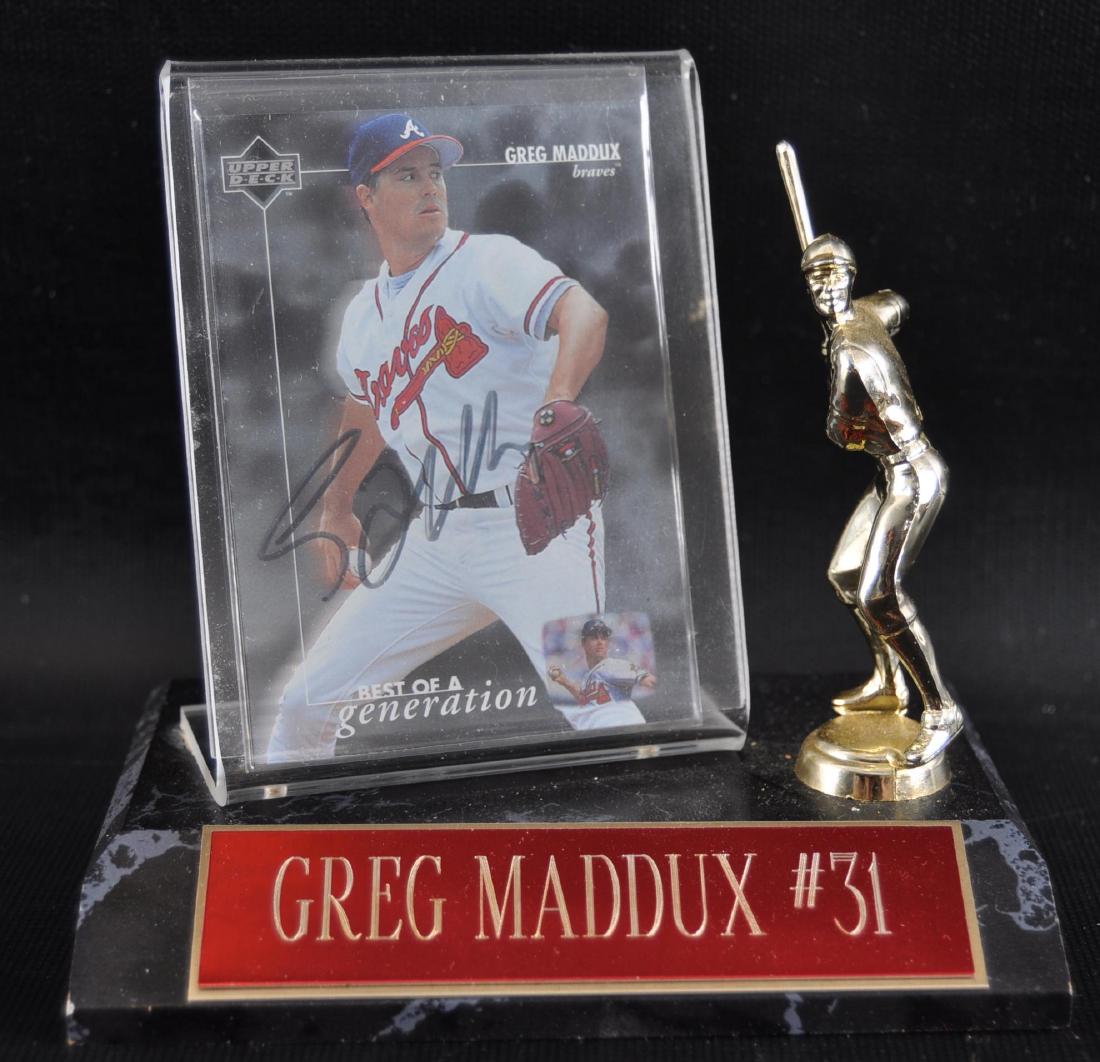 Signed Atlanta Brave Greg Maddoux Baseball Card with: Includes Display