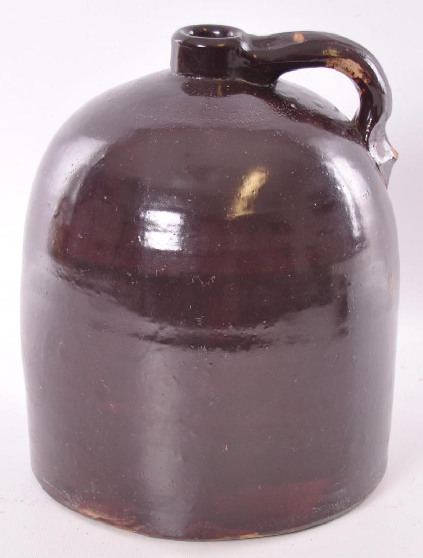 Antique 2 Gallon Brown Stoneware Jug: Chip on handle, 9 x 12 inches