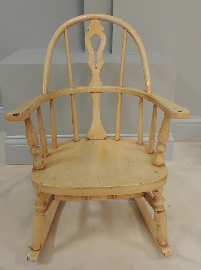 Antique Cream Painted Wood Child's Rocking Chair: 16 1/2 x 21 x 24 1/2 inches. Shipping is not available for this item, pick up only