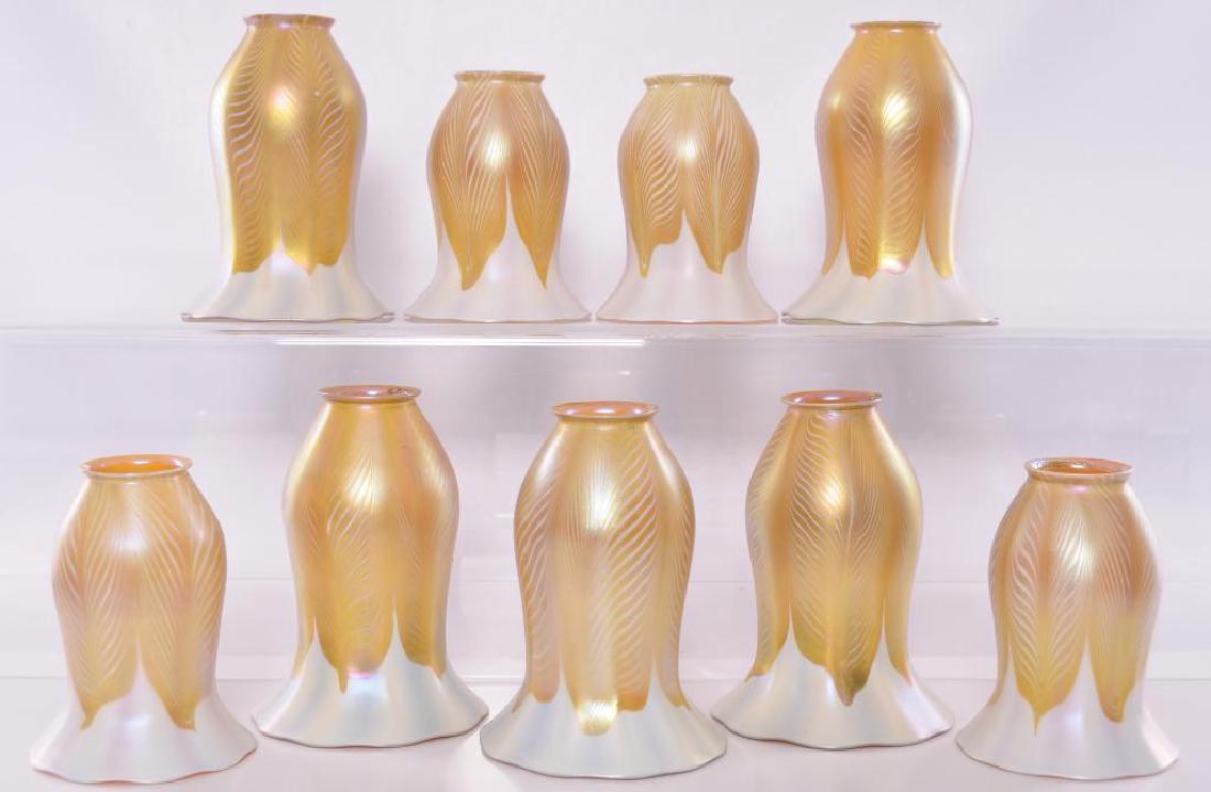 Antique Quezal Ceiling Fixture with 9 Hanging: An notably beautiful pairing of iridescent glass and Arts and Crafts style. The nine inverted tulip-form shades with a bold golden yellow pulled feather design are suspended from a 23 x 23 inch brass 