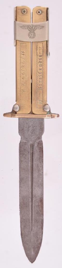 WW2 German Waffen SS Paratrooper Folding Knife: Marked RZM M7/66/34/SS Streifendienet on handle, Carl Eickhorn Solingen on blade. Overall length 7 3/4 inches