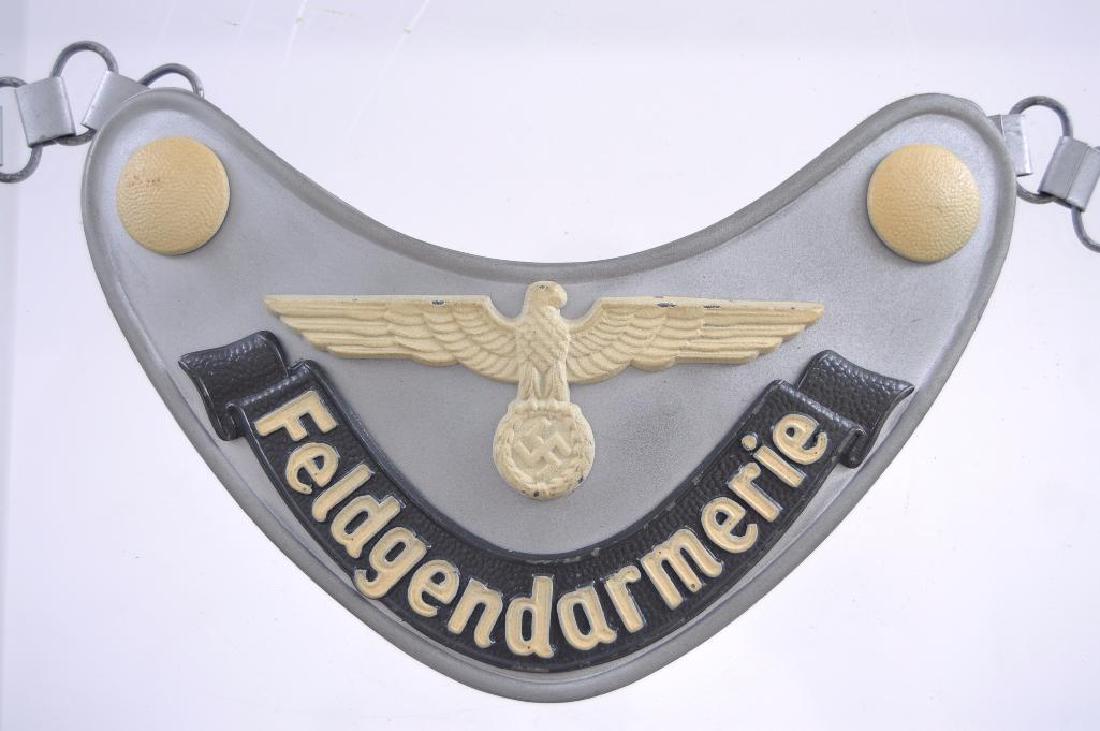 WW2 German Army Feldgendarmerie Gorget and Chain: Maker mark M inside of diamond, Gorget measures 6 1/2 x 3 inches.