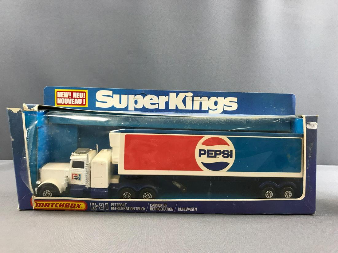Group of 2 Matchbox Super Kings Refrigeration Trucks: K-31 Peterbilt trucks Coca-Cola and Pepsi. Both have some damage to packaging. 1978 Lesney Products and Co.