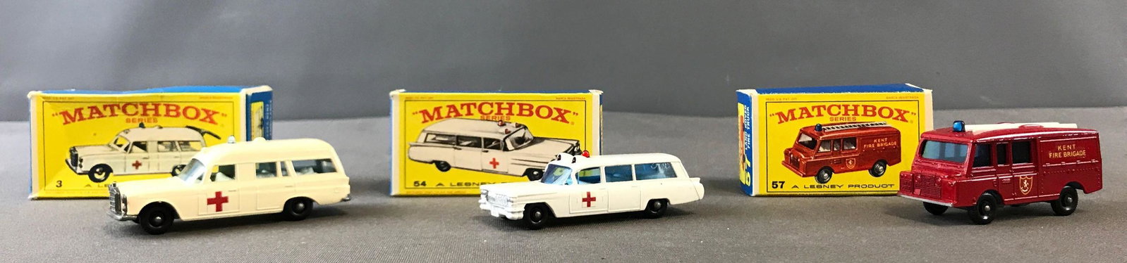 Group of 3 Matchbox Diecast Toy Cars: Firetruck &: Includes #57 Kent Fire Brigade, #3 Mercedes-Benz "Binz" Ambulance, and #54 S&S Cadillac Ambulance. A Lesney Product.