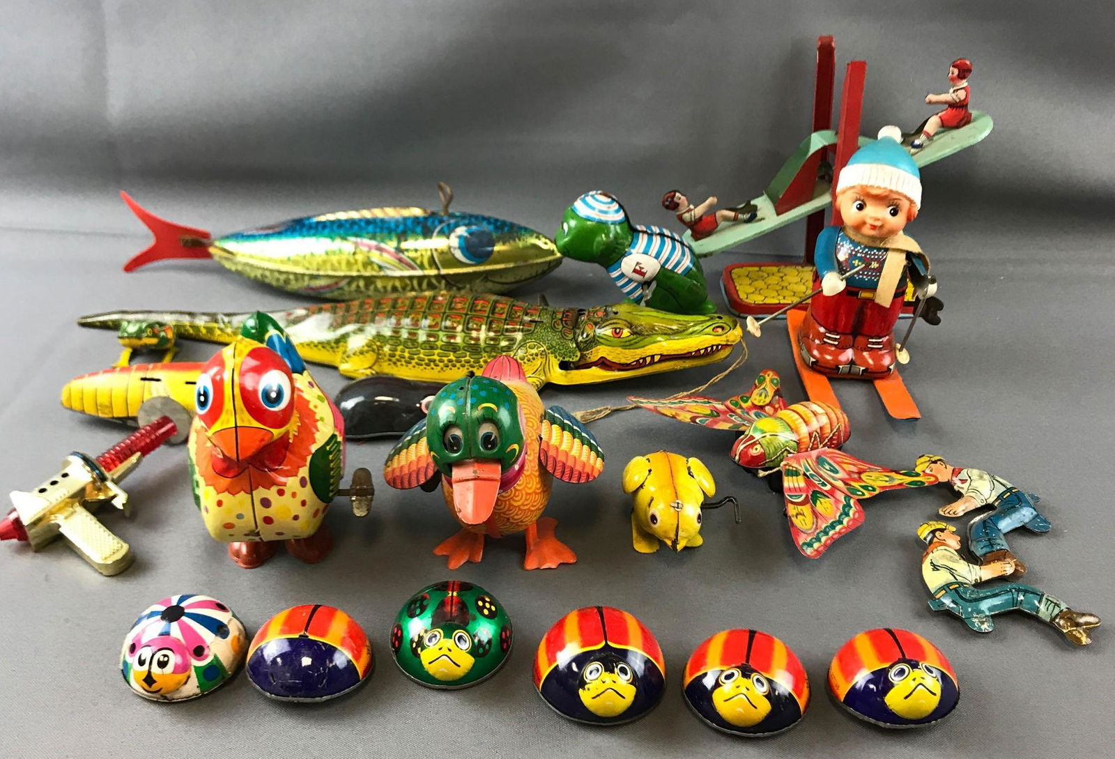 Vintage wind up toys: Some wind up, some roll on wheels