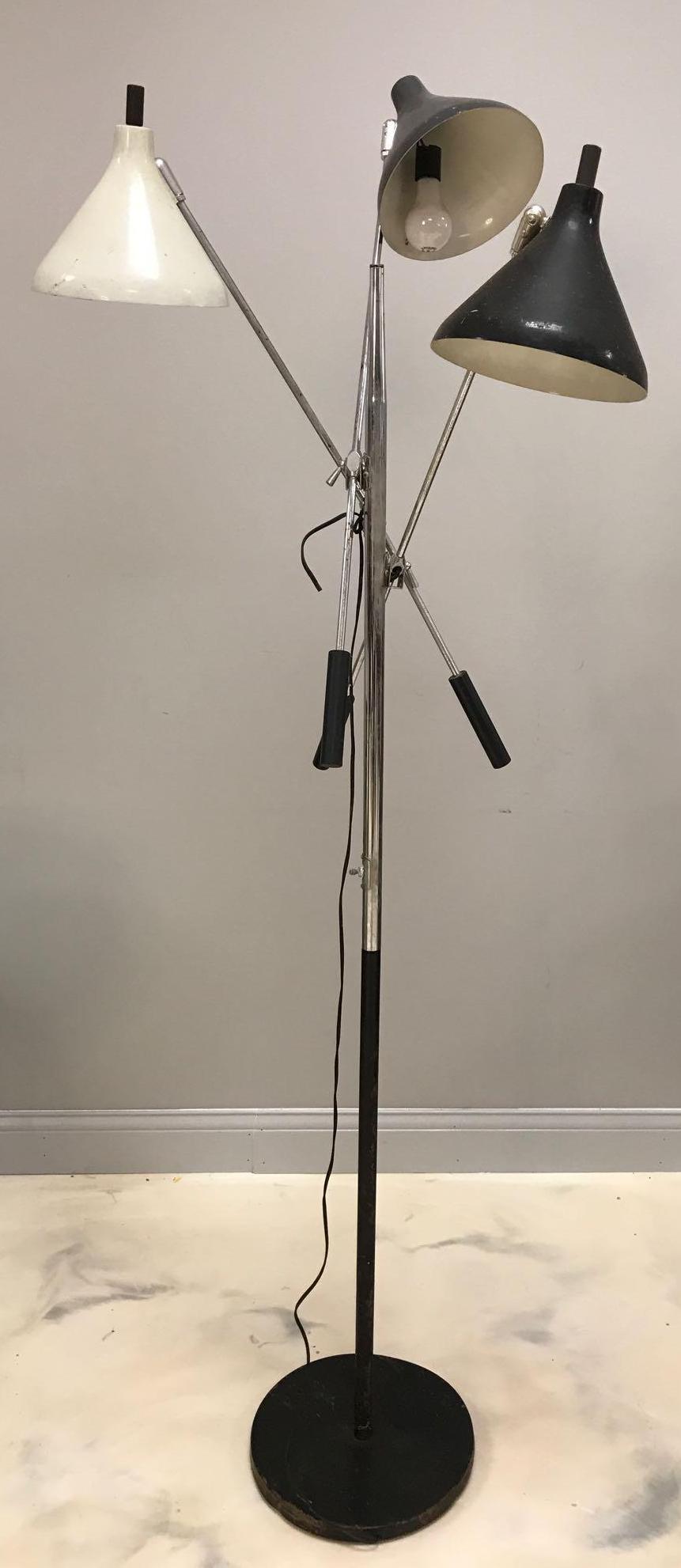 Vintage Industrial Floor lamp: 3 light floor lamp with movable arms, stands 70 inches tall. No shipping available.