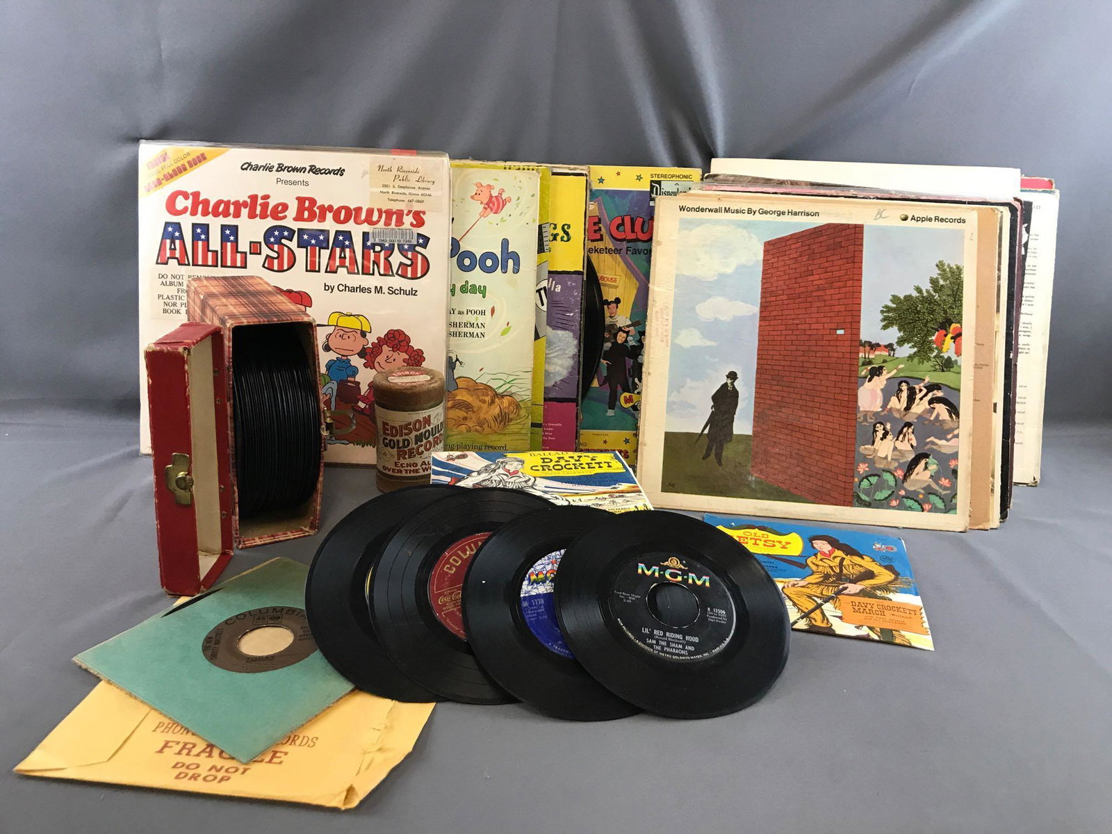 Group of records and more: Appx 25 LP : Disney, Pooh, Charlie Brown, Donovan, The Beatles, Rolling Stones, America, The Animals and more. 40+ 45 : Bobby Vinton, Tony Bennett, Jackson 5, Christmas tunes and more. 1 Edison Gould 