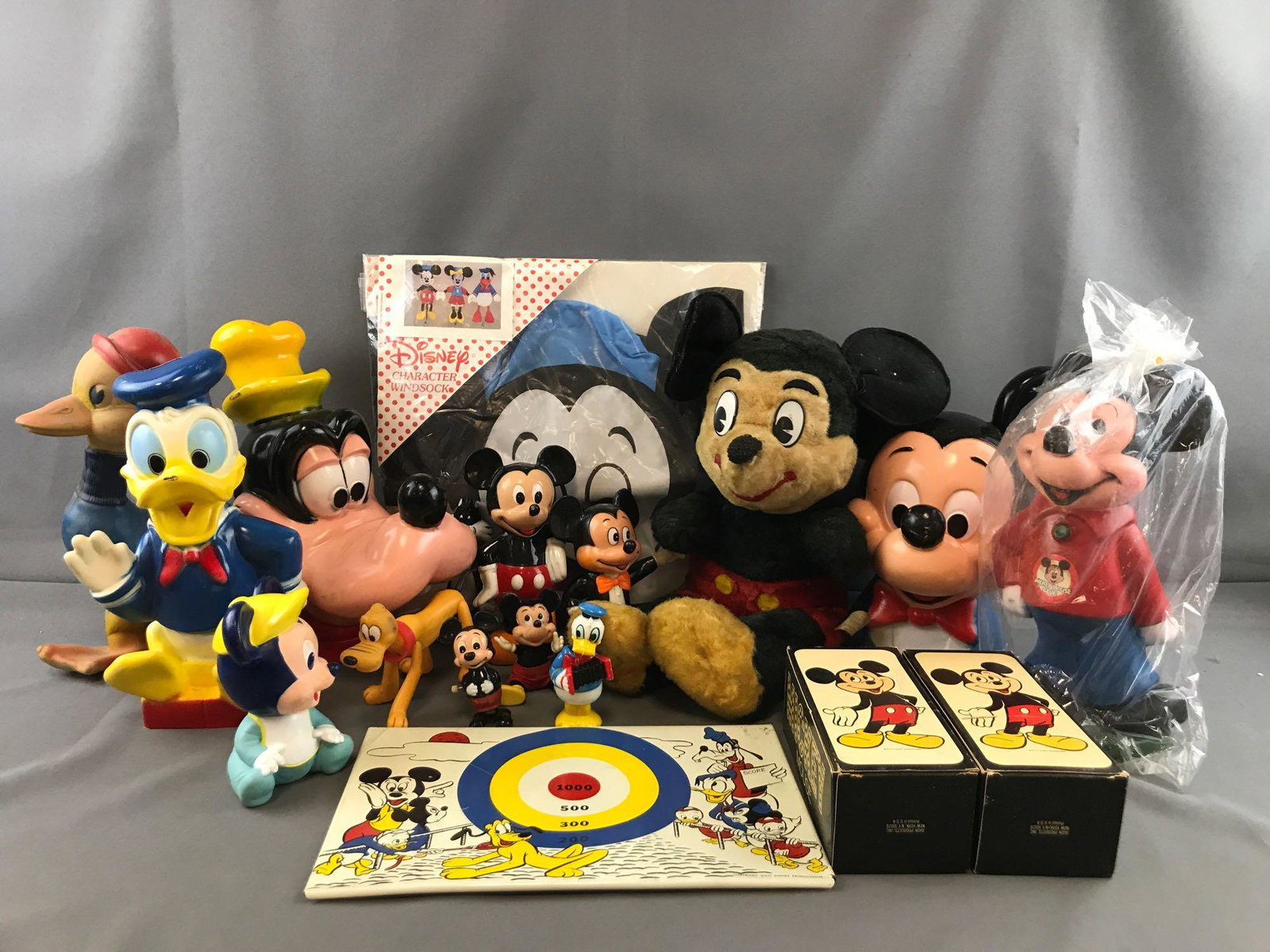 Group of 15+ vintage Disney items: Vintage Mickey plush, Mickey windsock in original package, Avon brand Mickey Bubble bath in original packaging and more