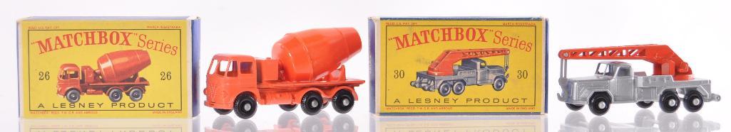Group of 2 Matchbox Die-Cast Vehicles with Original: Includes No. 30 6-heel Crane Truck with Silver Body and BRW, No. 26 Cement Lorry with Orange Body and BRW. A Lesney Product Made in England, MIB